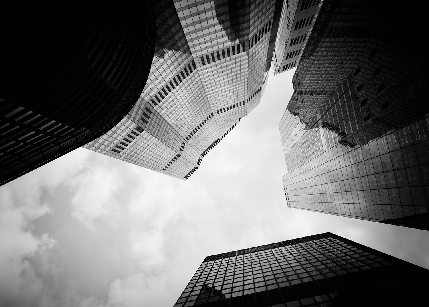 photograph from below of tall buildings in the city of London